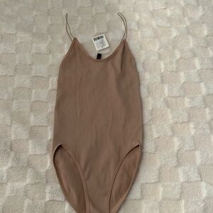 Brand, new Urban Outfitters nude bodysuit size small
